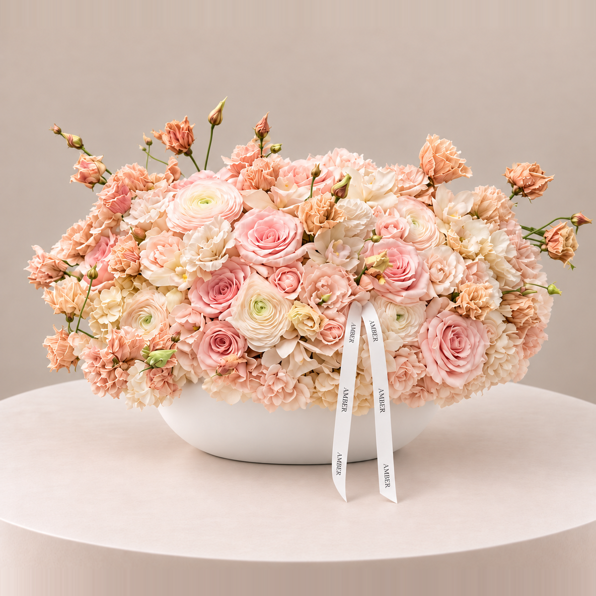 Ivory Blush large statement flower arrangement with blush, nude, cream and champagne flowers in a white oval vase by Amber Flowers Toronto